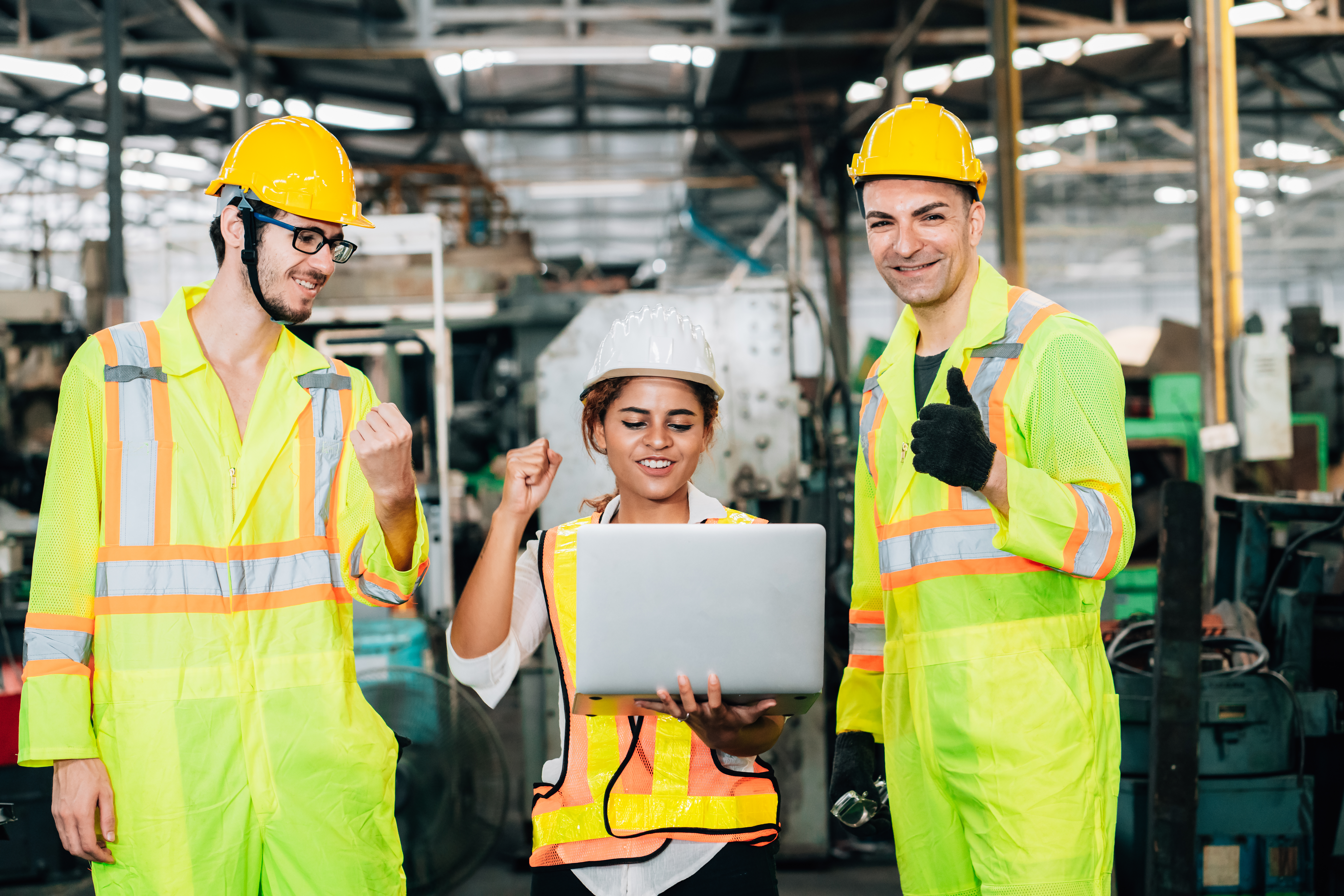 Cheerful engineers working factory